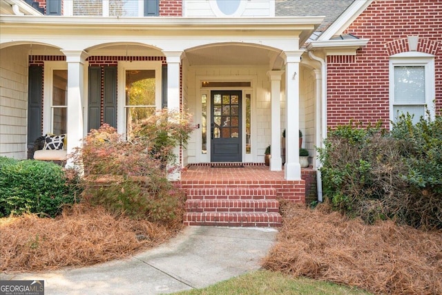 doorway to property featuring a porch