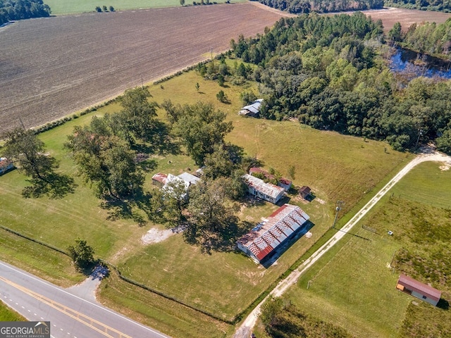 birds eye view of property featuring a rural view