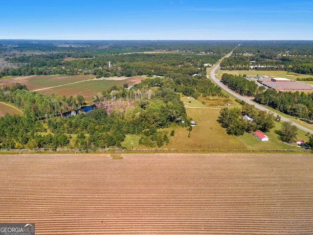 birds eye view of property featuring a rural view