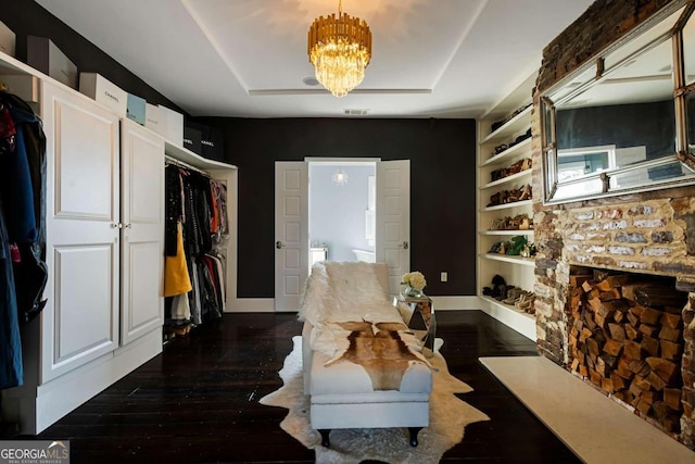 interior space featuring dark wood-type flooring and a notable chandelier