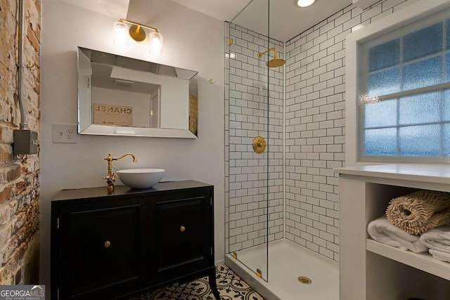 bathroom with vanity and tiled shower