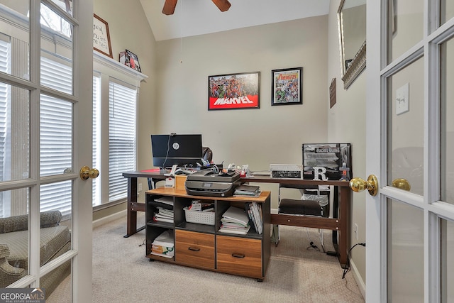 office space with vaulted ceiling, light colored carpet, and ceiling fan