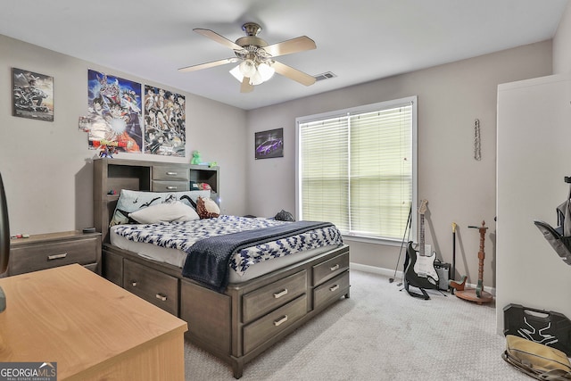 bedroom with light carpet and ceiling fan