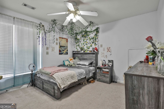 carpeted bedroom with ceiling fan