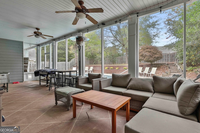 sunroom / solarium with ceiling fan