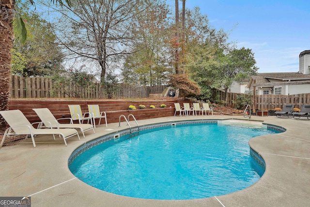 view of pool featuring a patio area