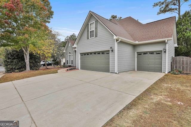 view of side of home with a garage