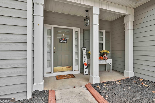 property entrance with covered porch