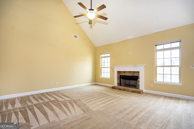 unfurnished living room featuring high vaulted ceiling, light carpet, and ceiling fan