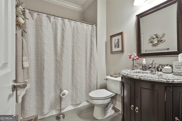 bathroom with toilet, vanity, tile patterned flooring, and crown molding