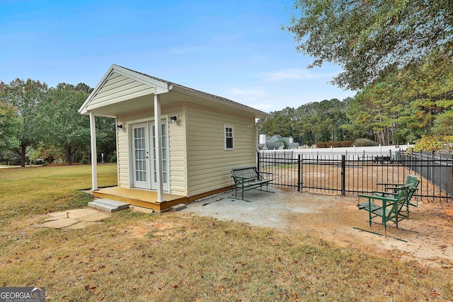 view of outbuilding featuring a yard