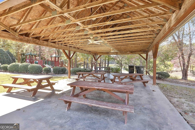 view of patio / terrace featuring outdoor dining space and playground community