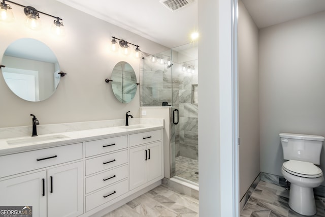 bathroom with toilet, vanity, and an enclosed shower