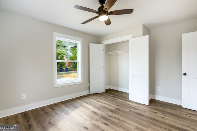 unfurnished bedroom featuring a closet, ceiling fan, and light hardwood / wood-style flooring