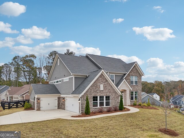 view of front facade featuring a garage and a front lawn