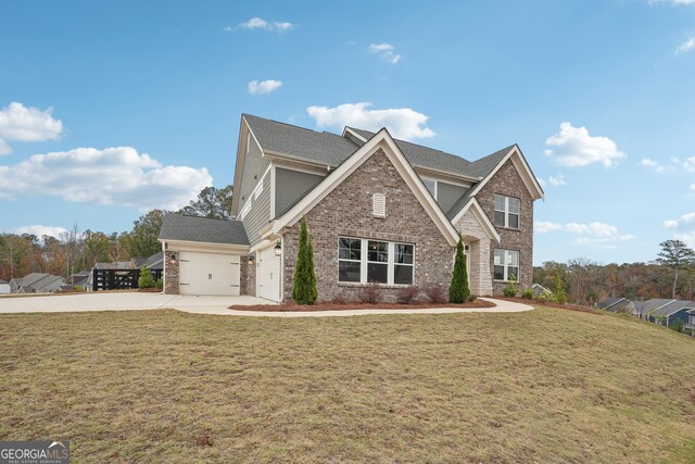 view of front facade featuring a front lawn and a garage