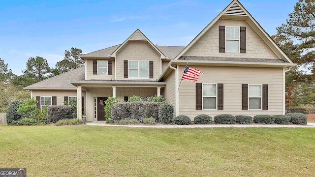 craftsman inspired home featuring a front lawn