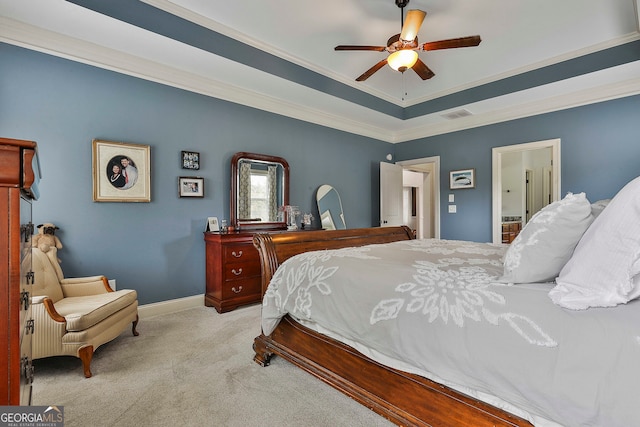 carpeted bedroom featuring crown molding, ceiling fan, and ensuite bathroom