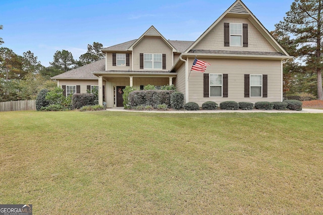 craftsman inspired home featuring a front lawn