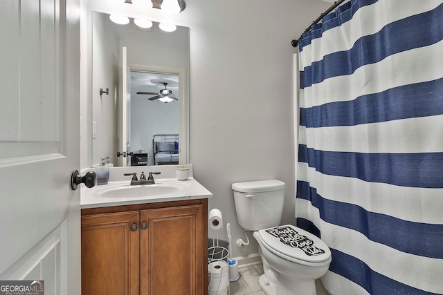 bathroom with toilet, tile patterned floors, vanity, ceiling fan, and walk in shower