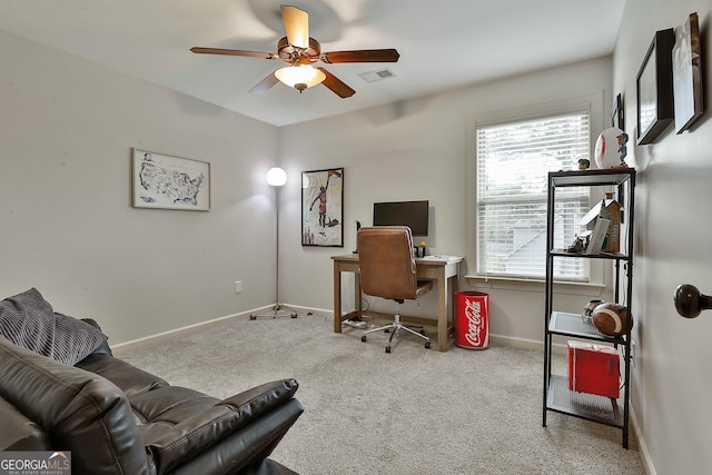 carpeted office featuring ceiling fan