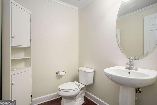 bathroom featuring toilet and ornamental molding