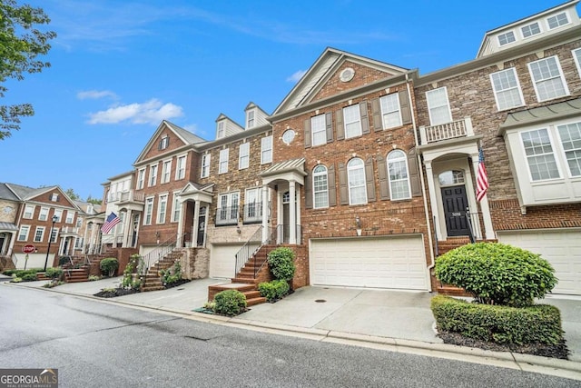 townhome / multi-family property featuring a garage