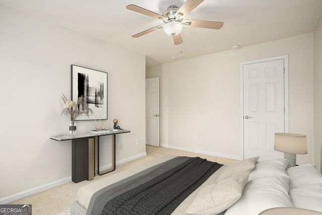 bedroom featuring ceiling fan and light carpet