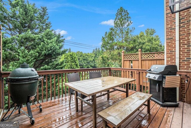 view of patio / terrace featuring a wooden deck and cooling unit