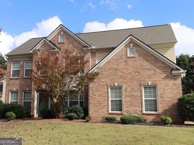 view of property with a front lawn