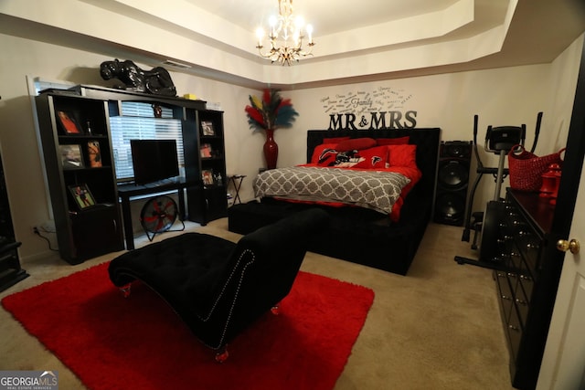 carpeted bedroom with a raised ceiling and an inviting chandelier