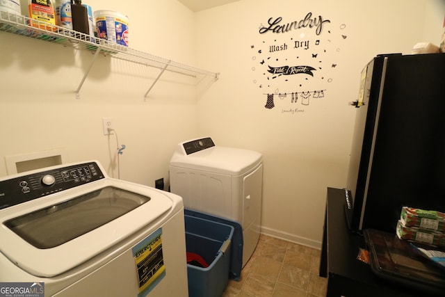 clothes washing area featuring washing machine and clothes dryer