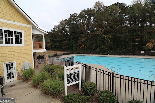 view of swimming pool featuring a patio area