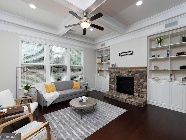 living room with ornamental molding, a fireplace, dark wood-type flooring, and beamed ceiling