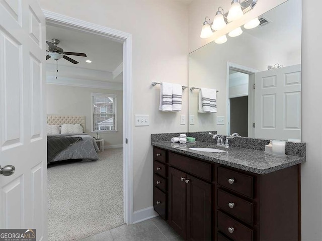 bathroom featuring vanity, tile patterned flooring, and ceiling fan