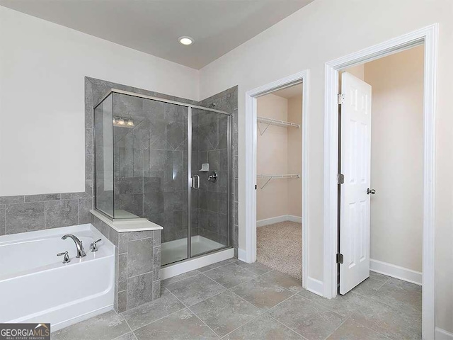 bathroom featuring plus walk in shower