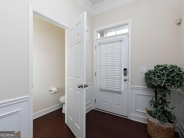 interior space with dark hardwood / wood-style floors and crown molding