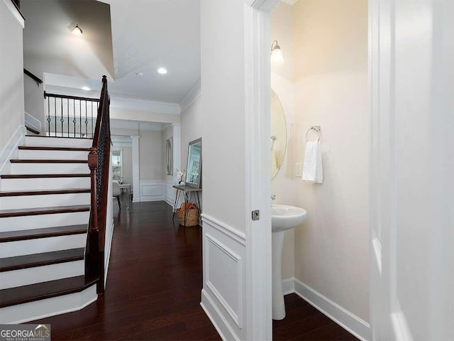 interior space with hardwood / wood-style flooring and ornamental molding