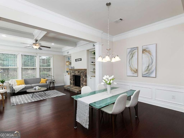 dining room with ornamental molding, dark hardwood / wood-style floors, beam ceiling, coffered ceiling, and ceiling fan