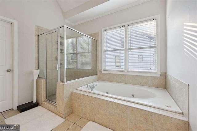 bathroom with a wealth of natural light, tile patterned flooring, plus walk in shower, and crown molding