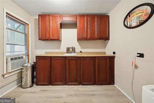 kitchen featuring light hardwood / wood-style floors, sink, and cooling unit