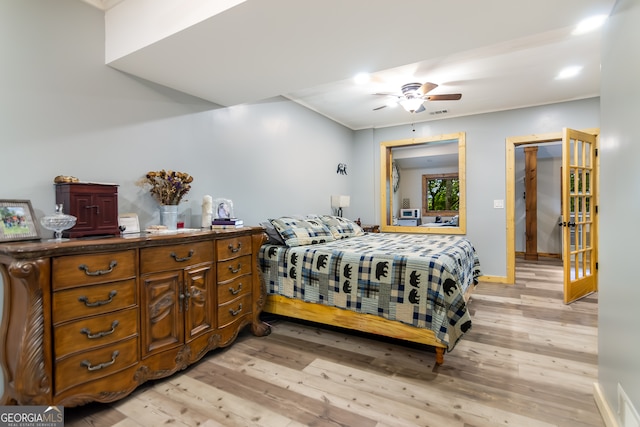 bedroom with light hardwood / wood-style flooring and ceiling fan