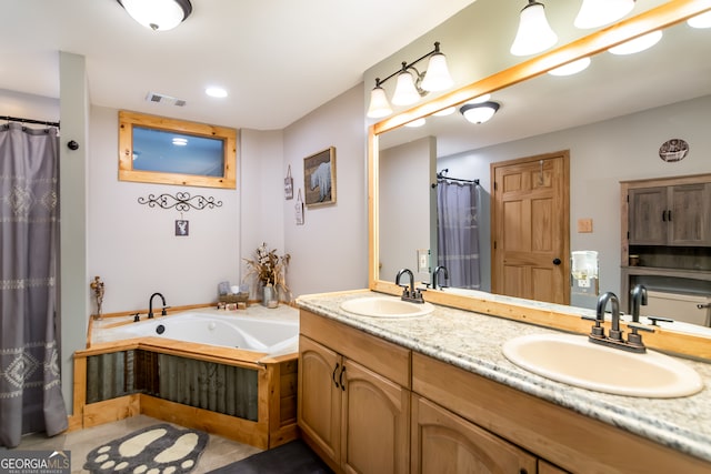 bathroom featuring vanity and a bath