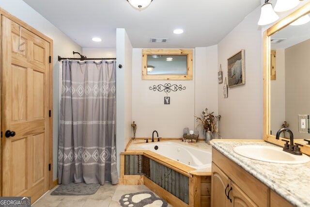 bathroom with tile patterned flooring, vanity, and plus walk in shower