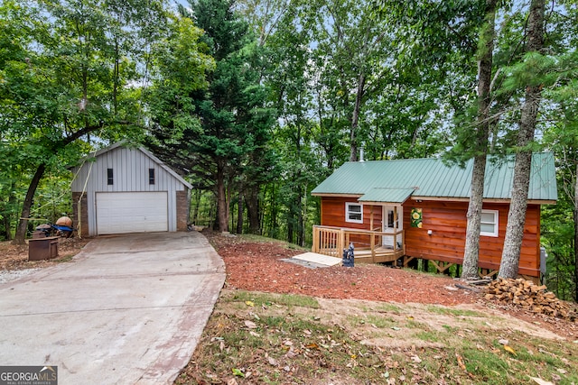 view of front of property with an outbuilding and a garage