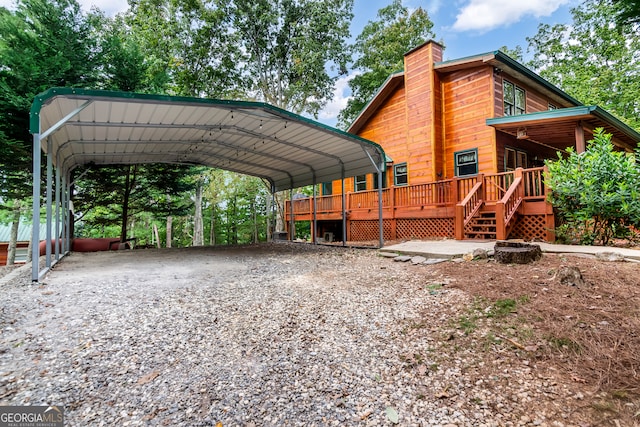 view of vehicle parking with a carport