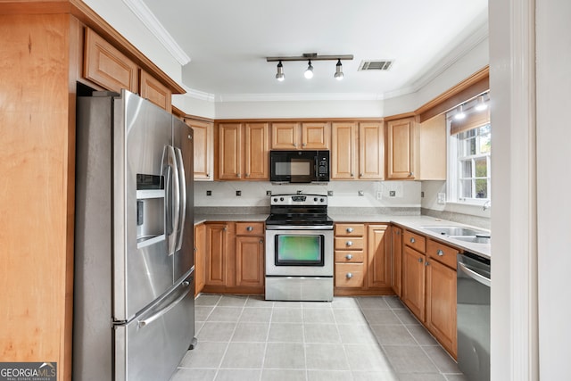 kitchen with backsplash, appliances with stainless steel finishes, sink, and crown molding