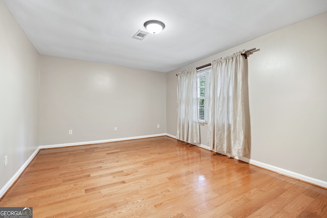 unfurnished room featuring light wood-type flooring