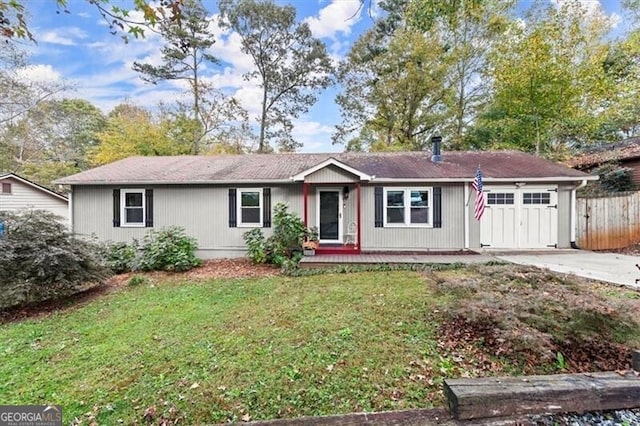 single story home featuring a front yard and a garage