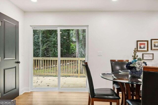 dining space with light hardwood / wood-style flooring